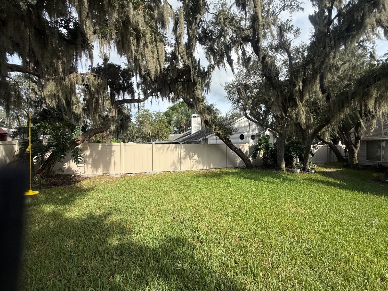 Backyard perimeter with vinyl privacy fencing