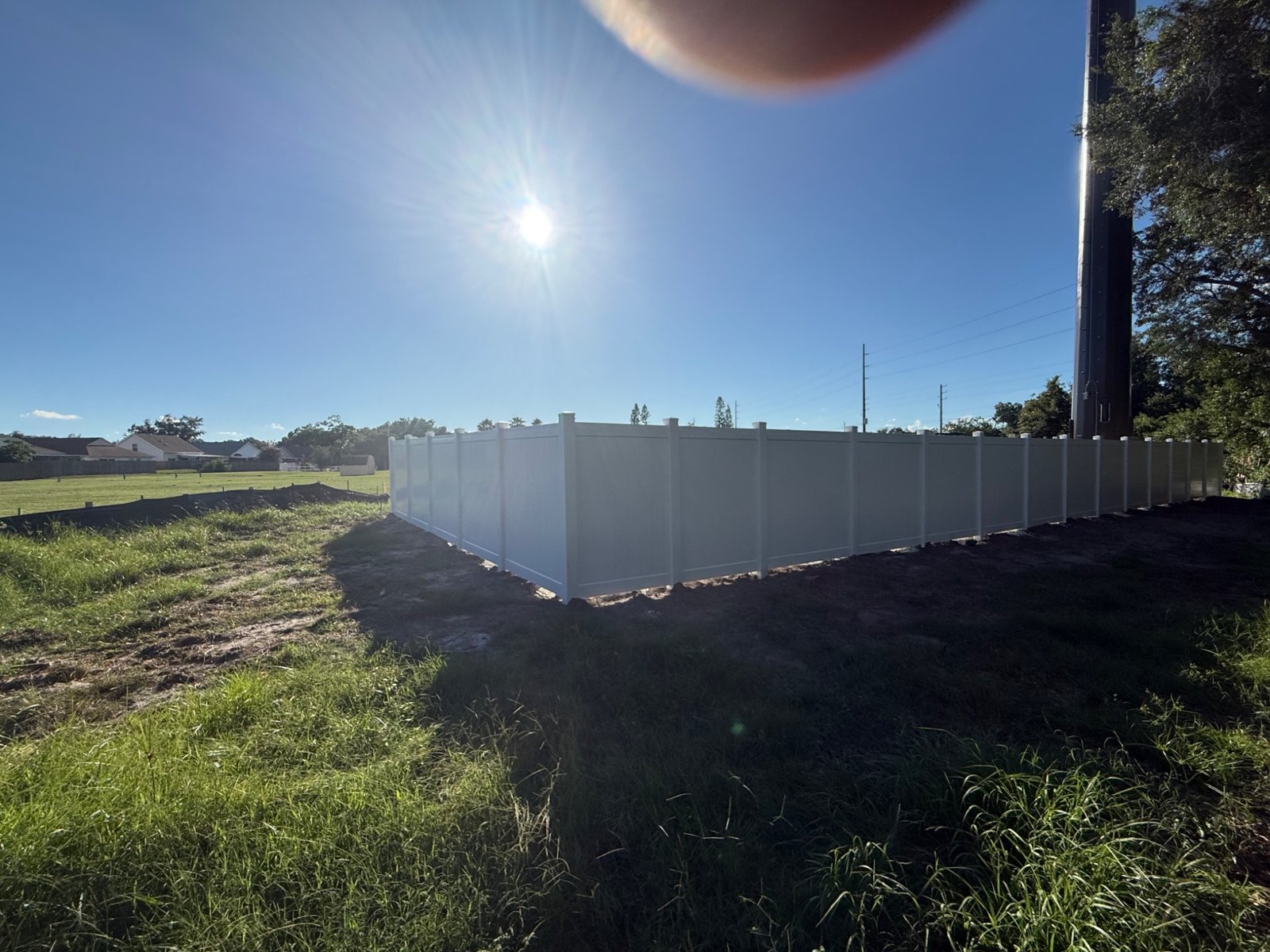 Wide view of a vinyl fence perimeter