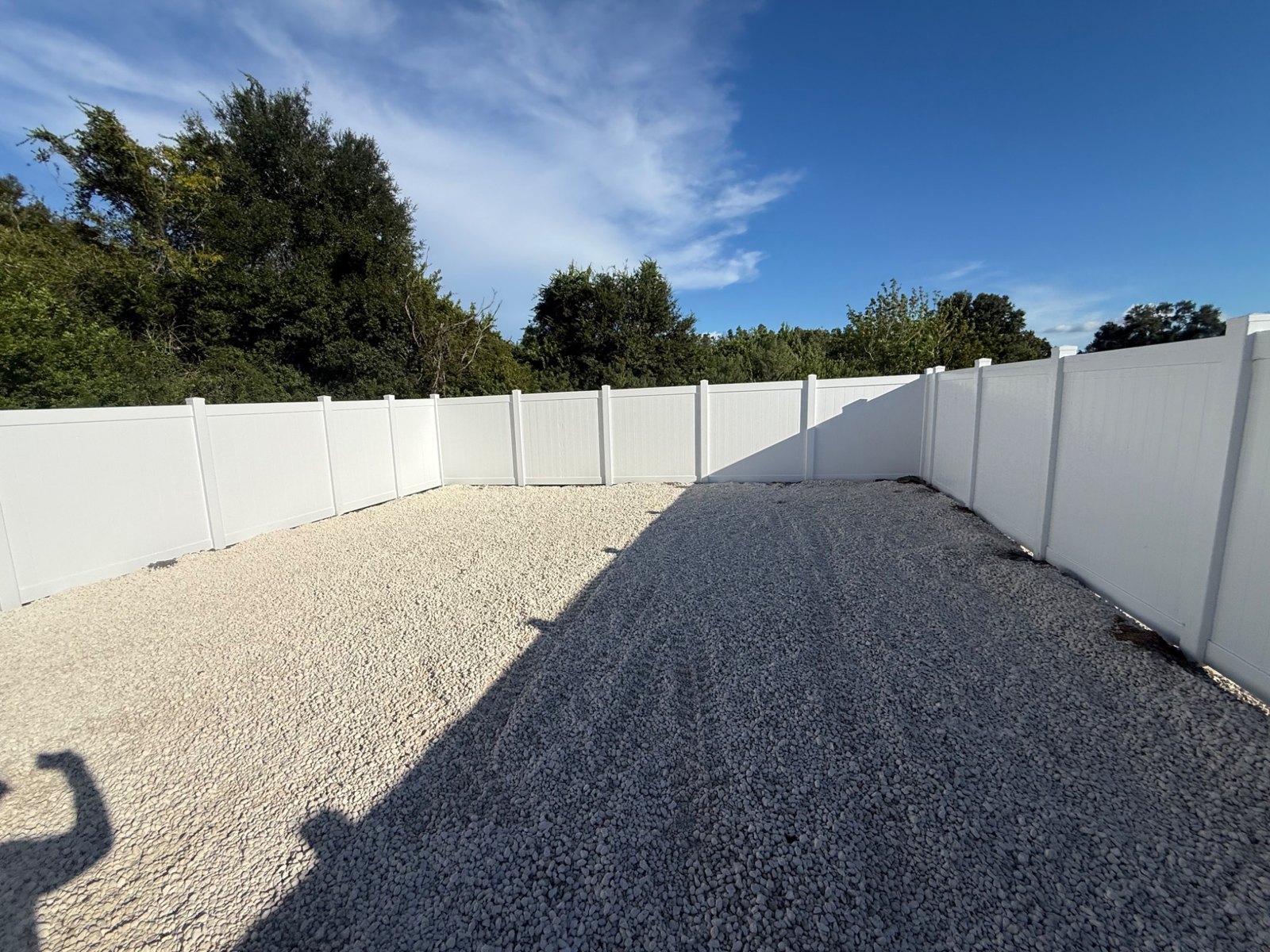 Vinyl privacy panels around an enclosure