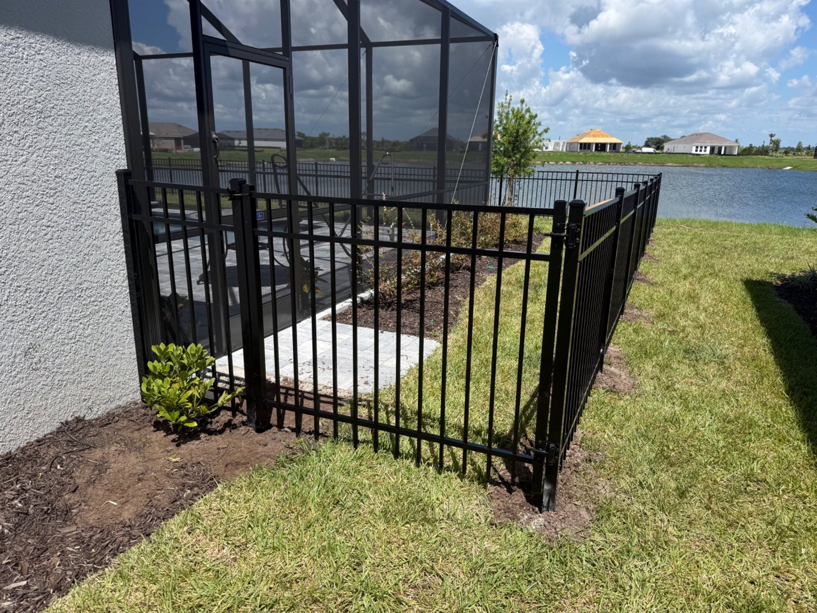 Black aluminum gate near a home
