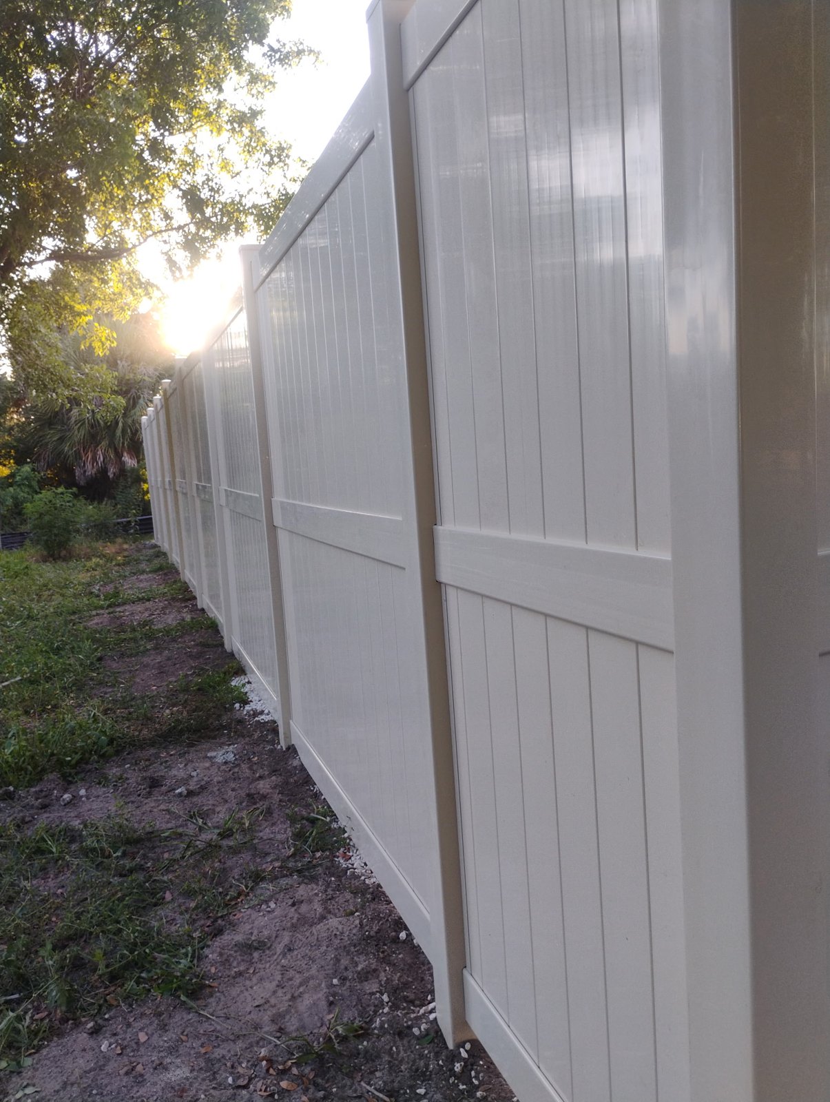 Tan vinyl privacy fencing — view 3