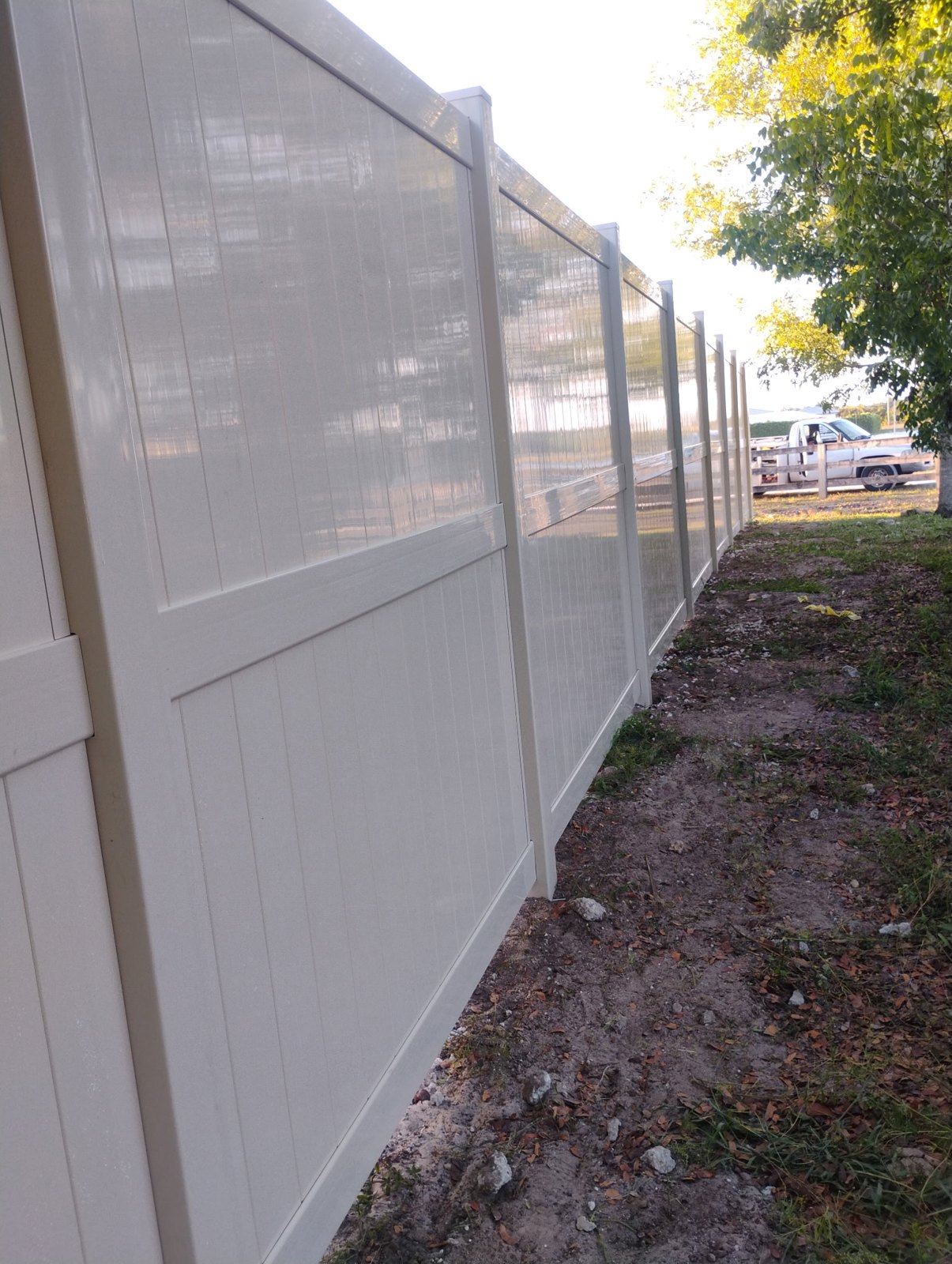 Tan vinyl privacy fencing — view 5