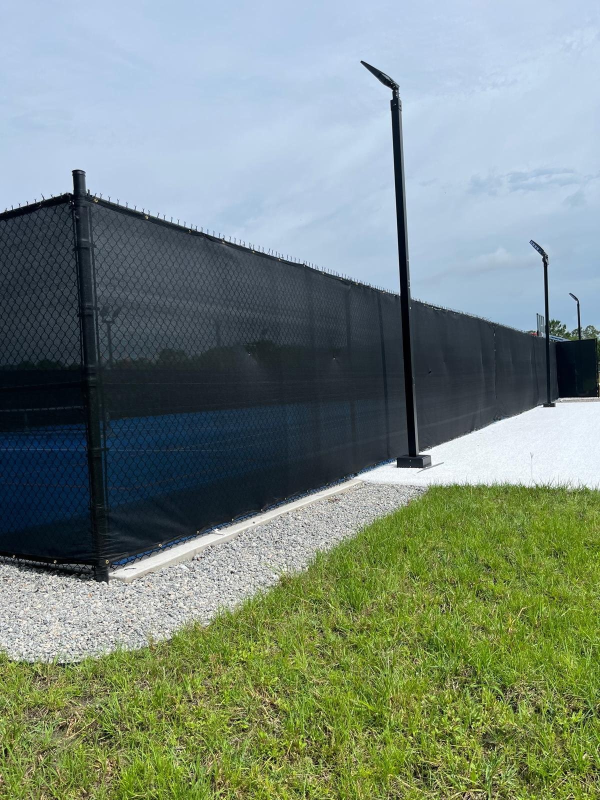 Black court fencing with windscreen — view 7