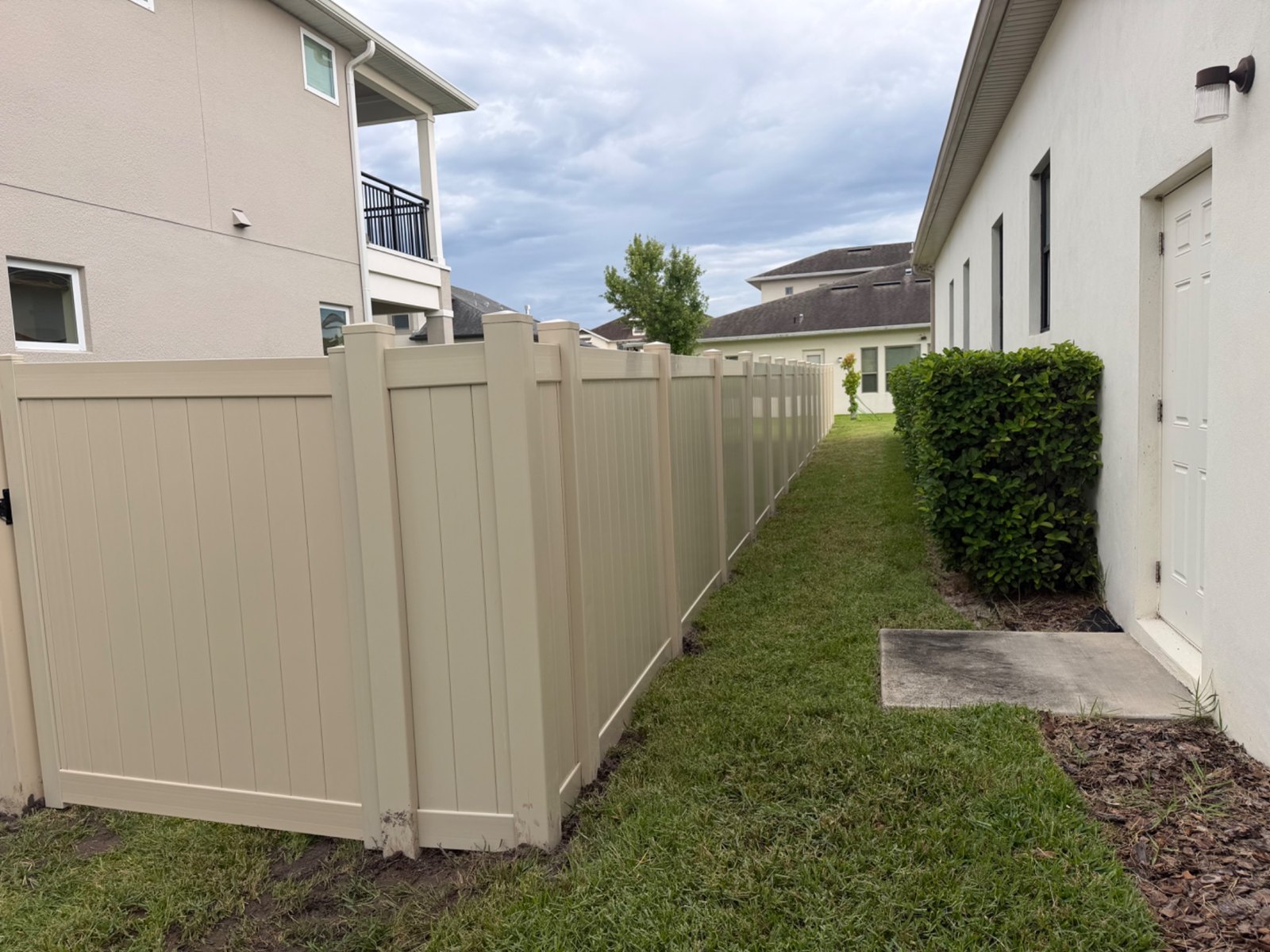Tan vinyl privacy fencing — view 18