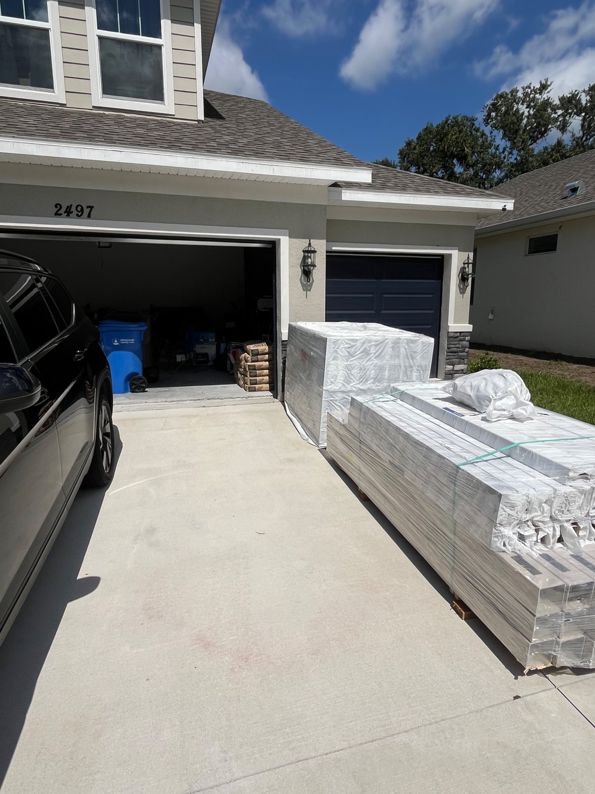 White vinyl materials delivered beside a home