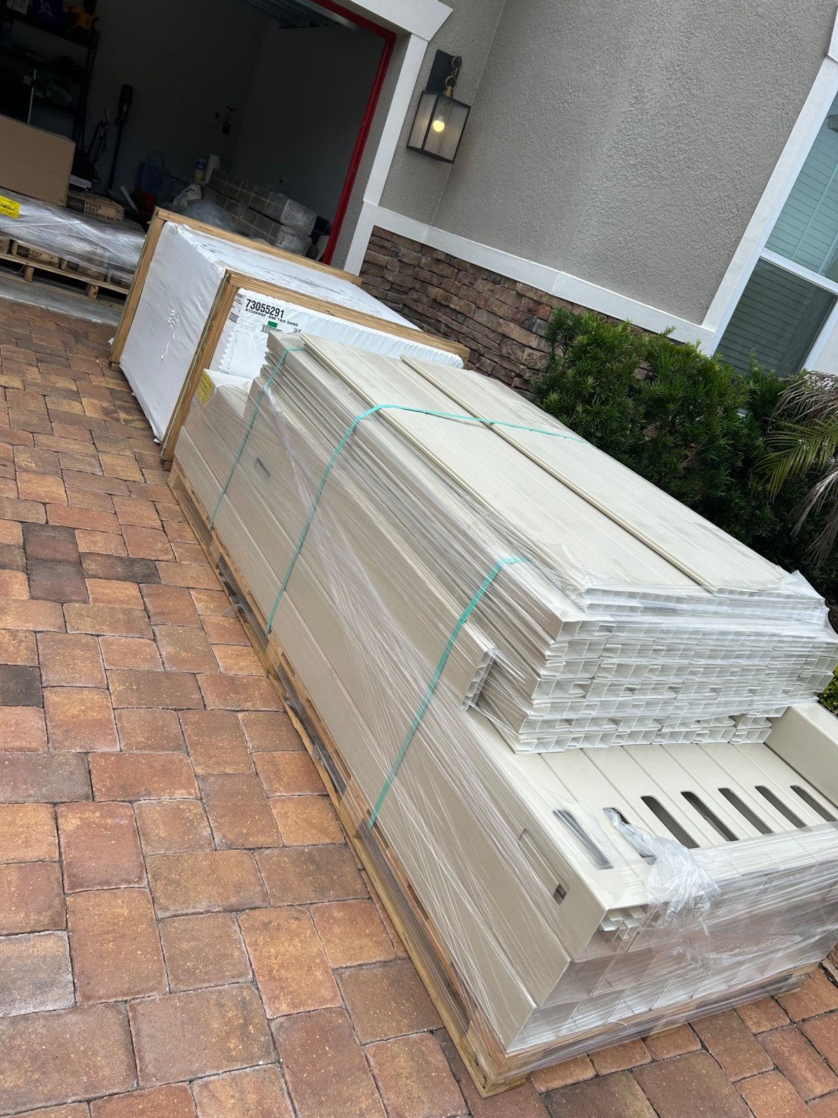 Vinyl panels and posts stacked for delivery