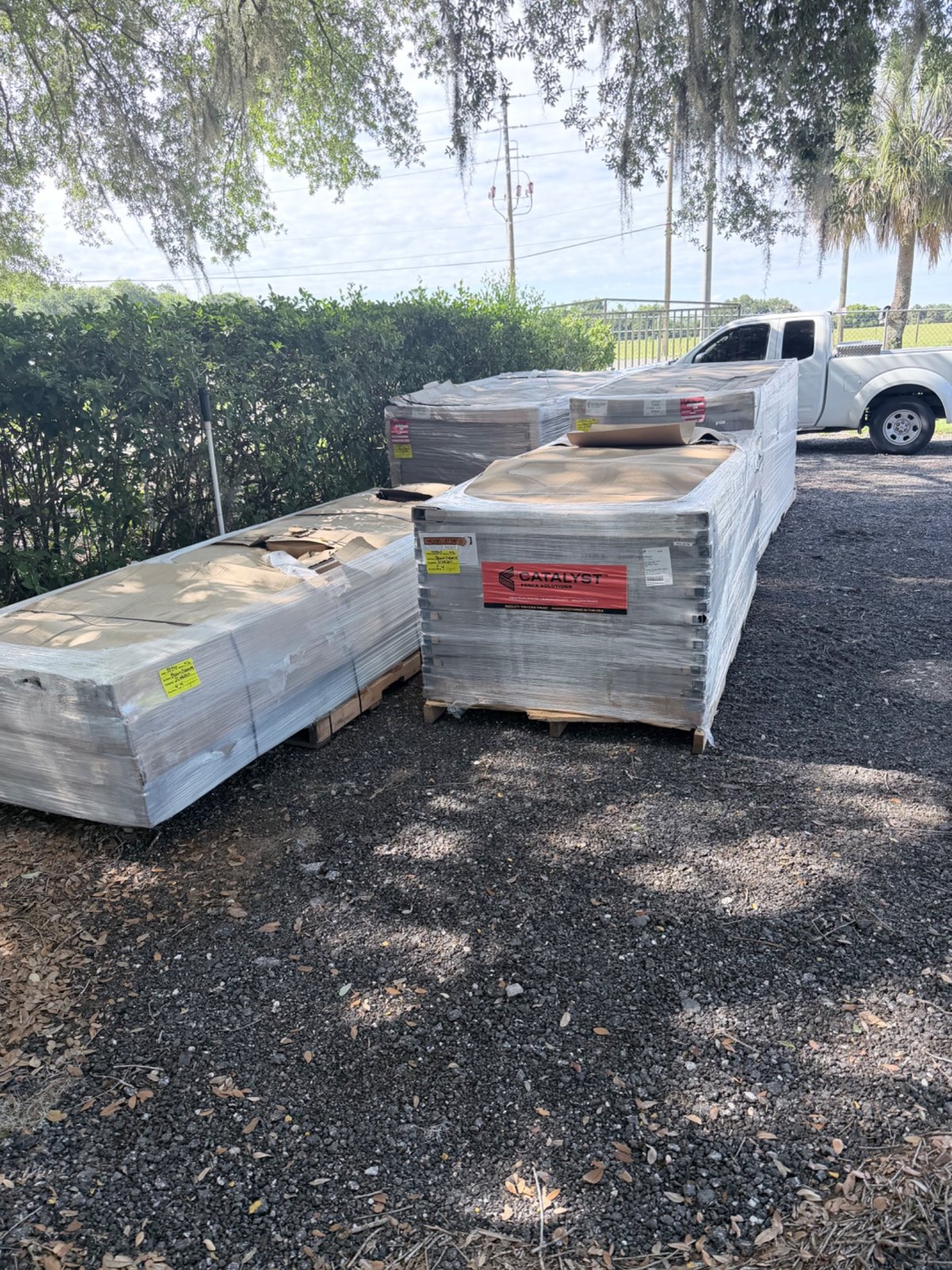 Fence material pallets at a delivery location