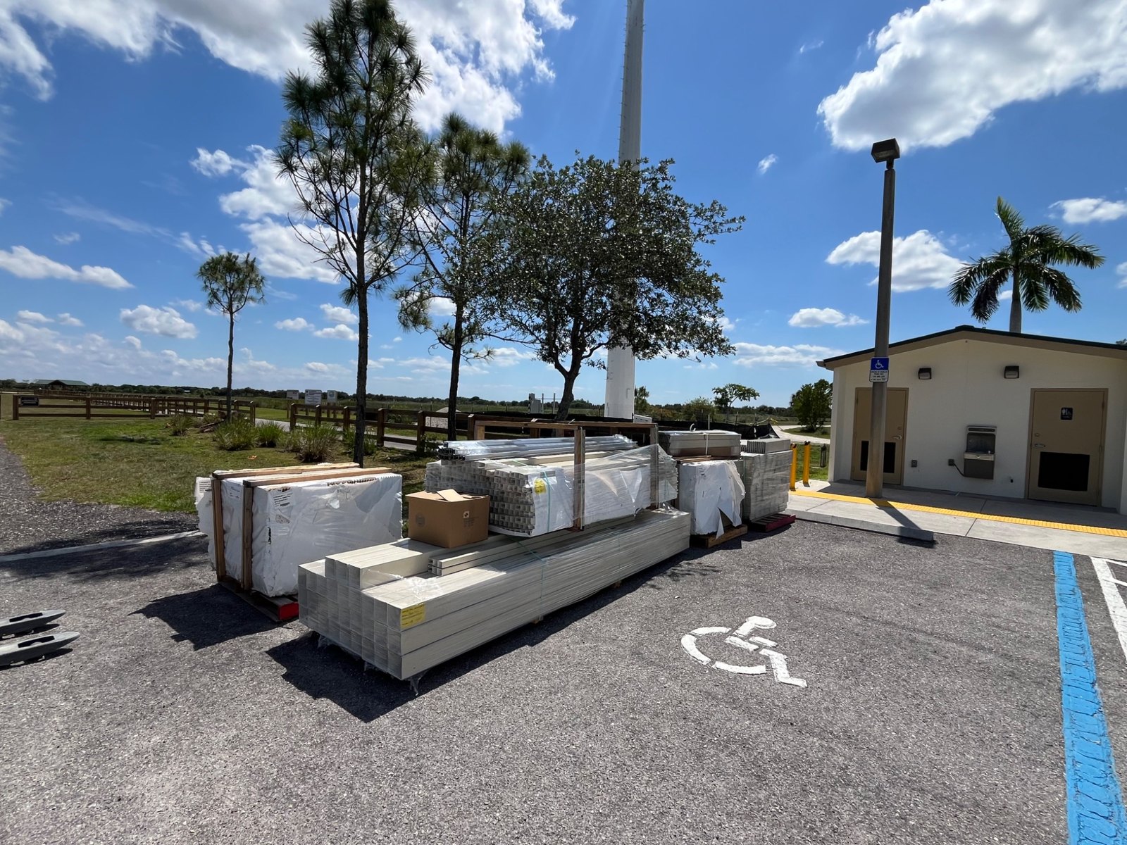 Pallets of fence materials delivered to a commercial site